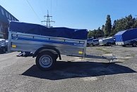 Прицеп Кремень стандарт плюс 2,31*1,31 с бортом 50 см с тентом 70 см