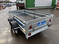 Прицеп Кремень стандарт плюс двухосный 3,0*1,56А см с бортом 50 с тентом 100 см
